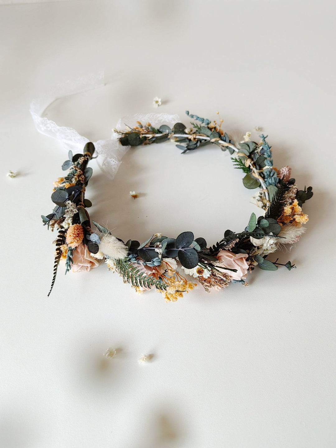 Floral crown with dried flowers on a white background