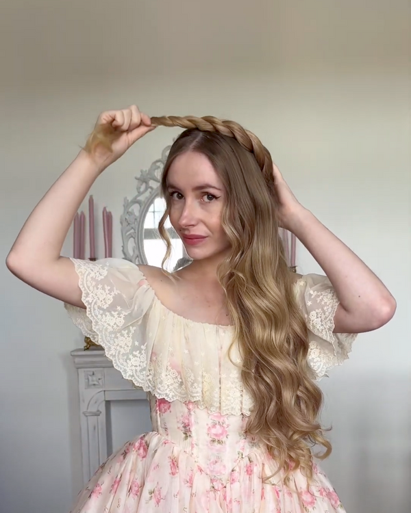 Create a tight braid close to the scalp on one side of your head. This braid will serve as the base for attaching the garland later.