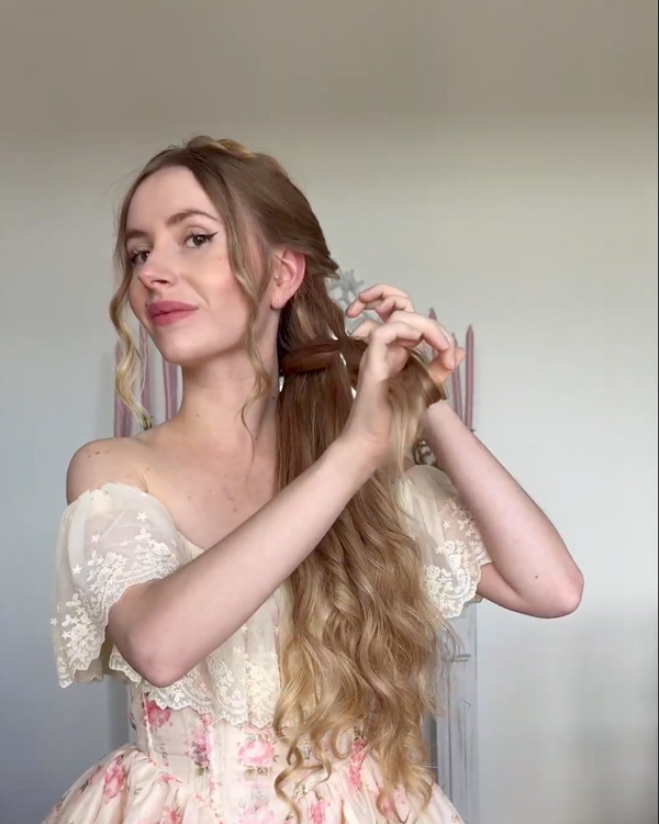 Start braiding your hair into a fishtail braid. Use small elastic bands to help secure the sections.