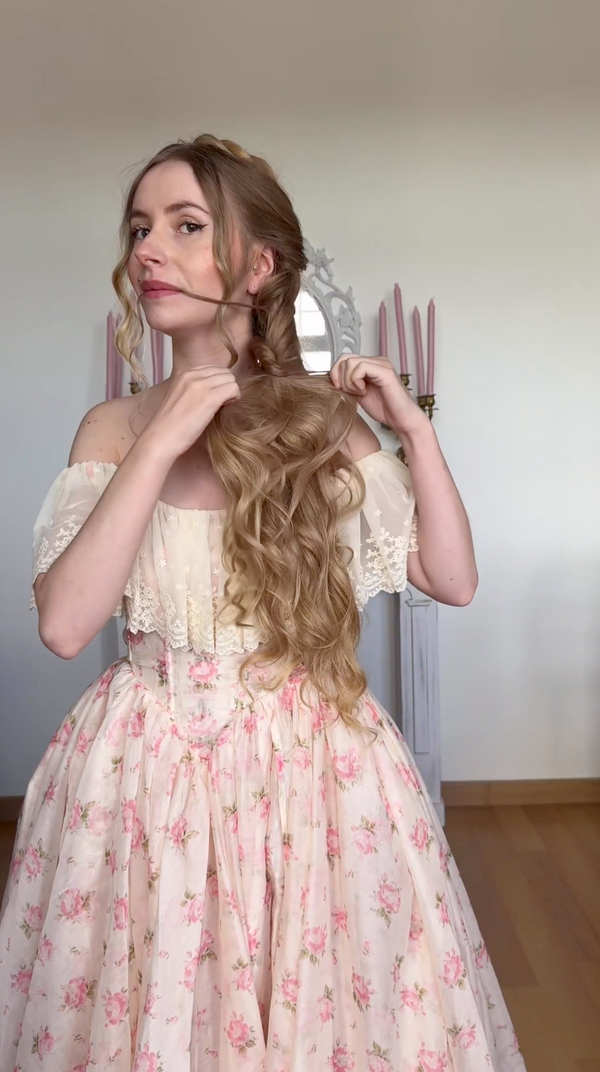 As you braid, loop each strand through the elastic, gently twist it, and pull it slightly to create a soft, airy look.