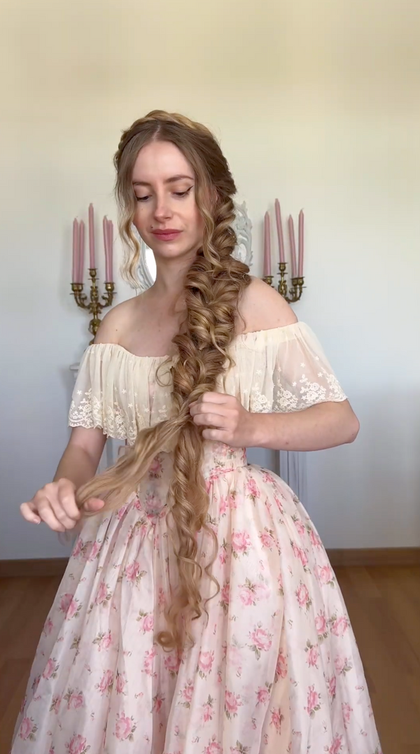 For a longer and fuller braid, add a hair extension. Attach it discreetly at the back of the braid.