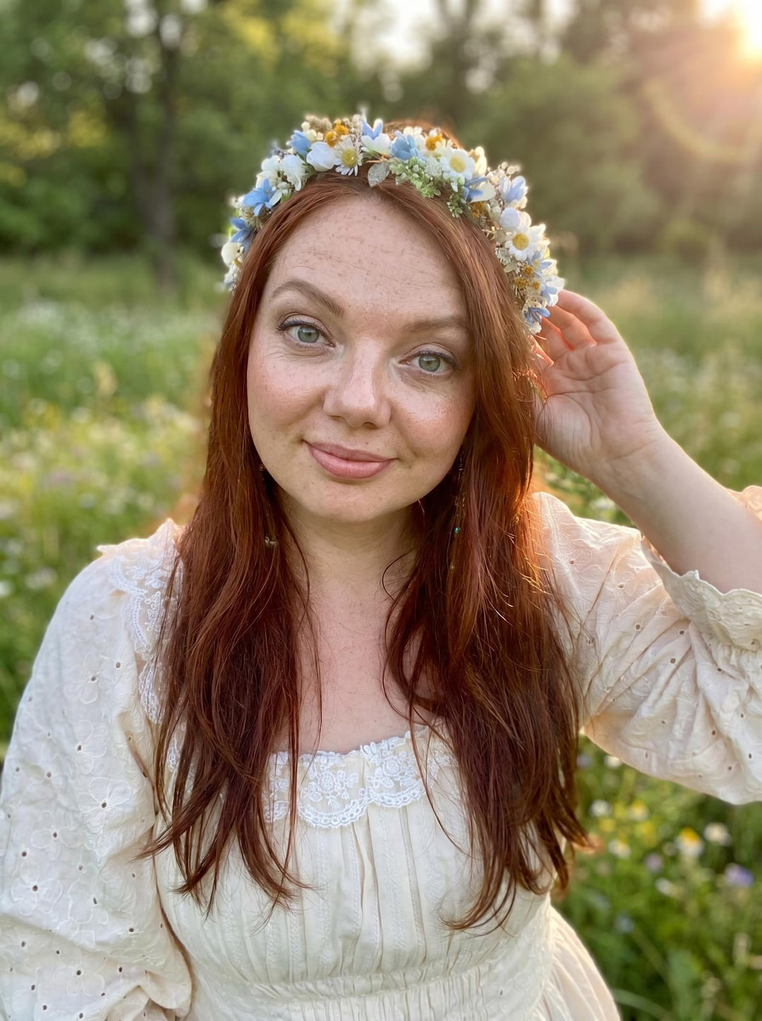 Woman with a floral crown in a field of flowers