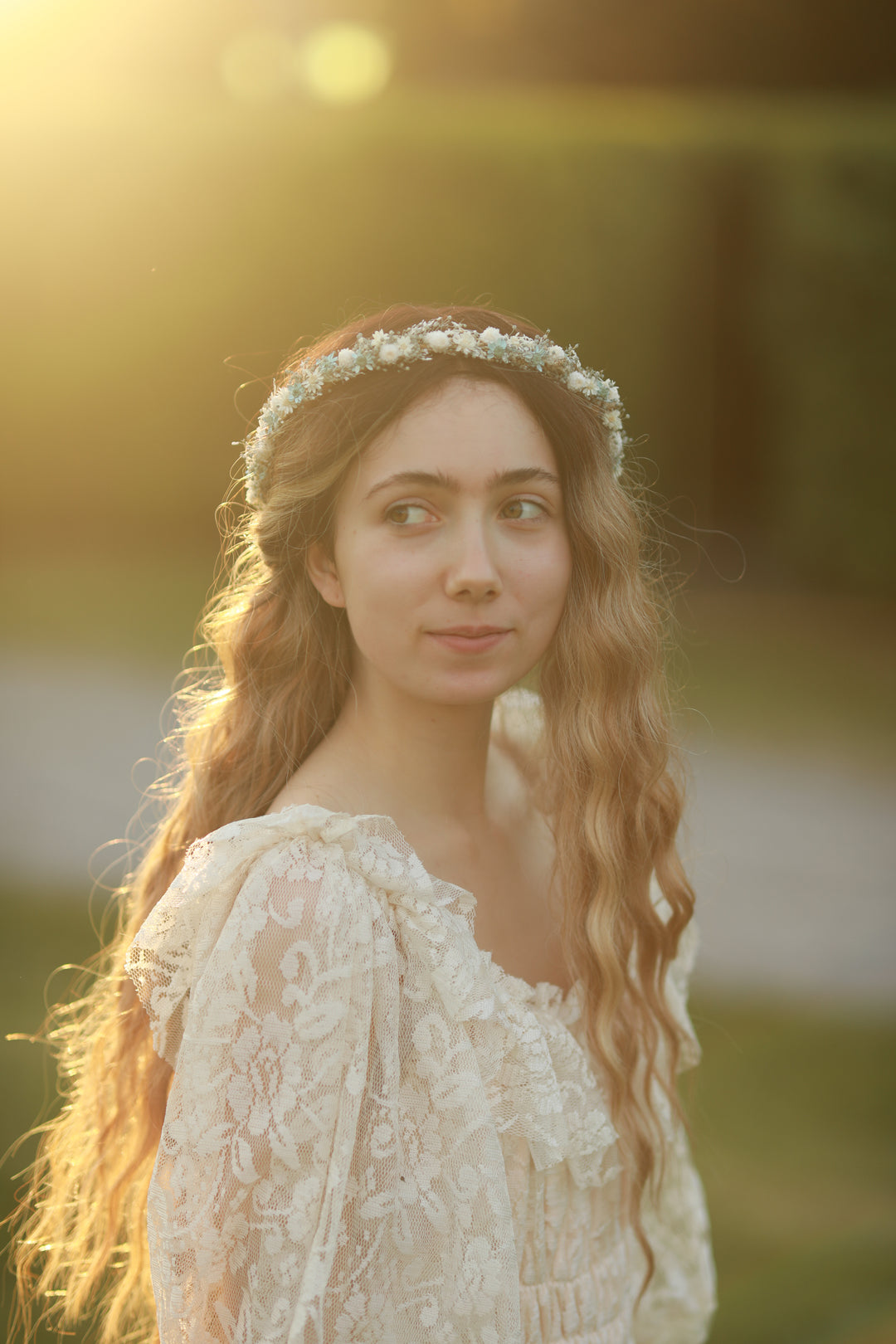 Blue and cream dried flower bridal crown worn in loose wavy hair, golden hour bridal portrait, handmade by Magaela 
