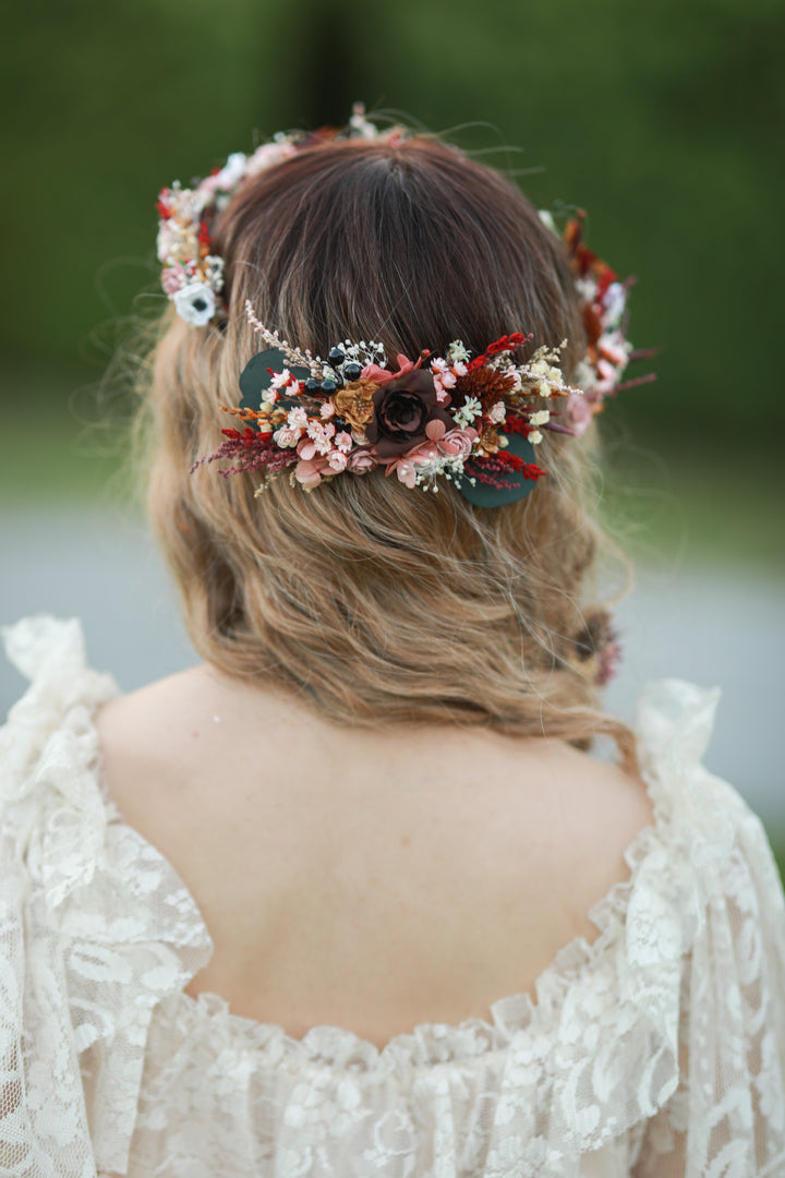 Blush and burgundy bridal hair comb with roses, white anemones, red dried florals and eucalyptus worn in bridal updo, handmade by Magaela