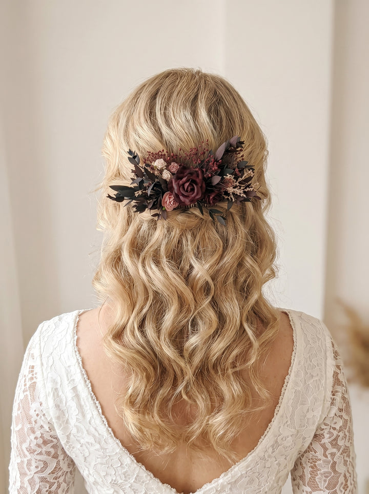 Blonde hair with floral burgundy hair comb and white lace top