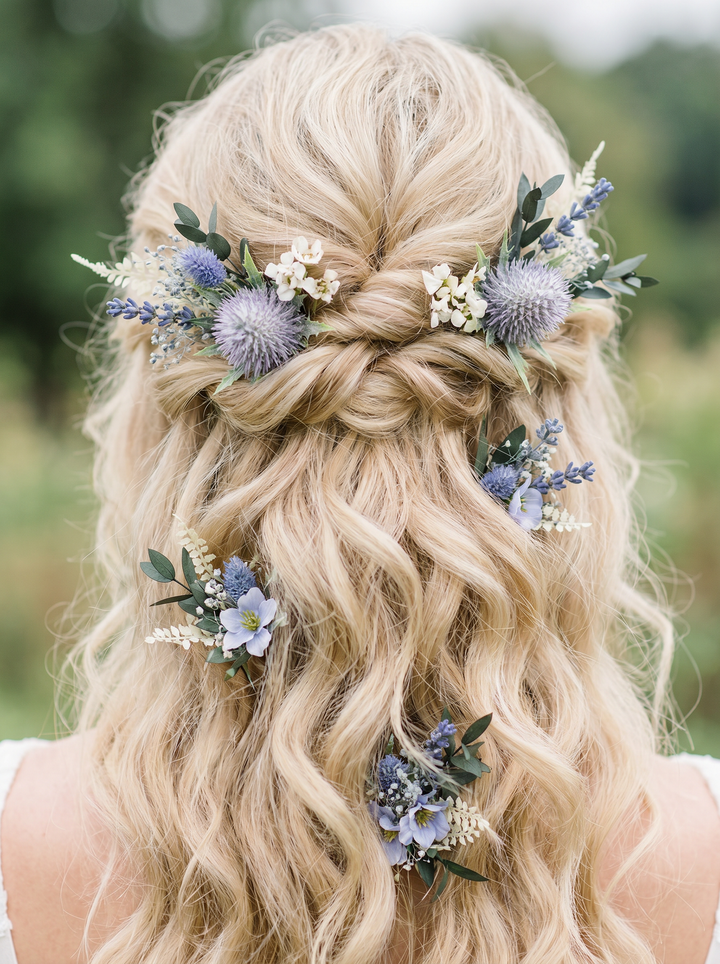 Blonde hair styled in a braid with floral decorations against a blurred natural background