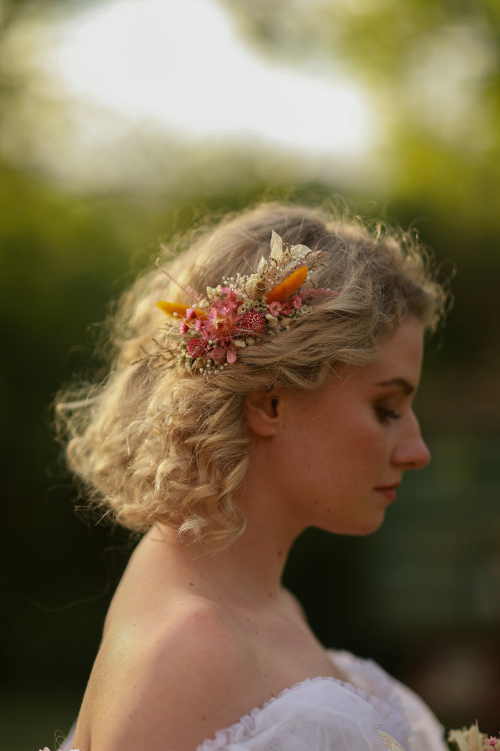 Woman with floral hairpiece in a natural setting