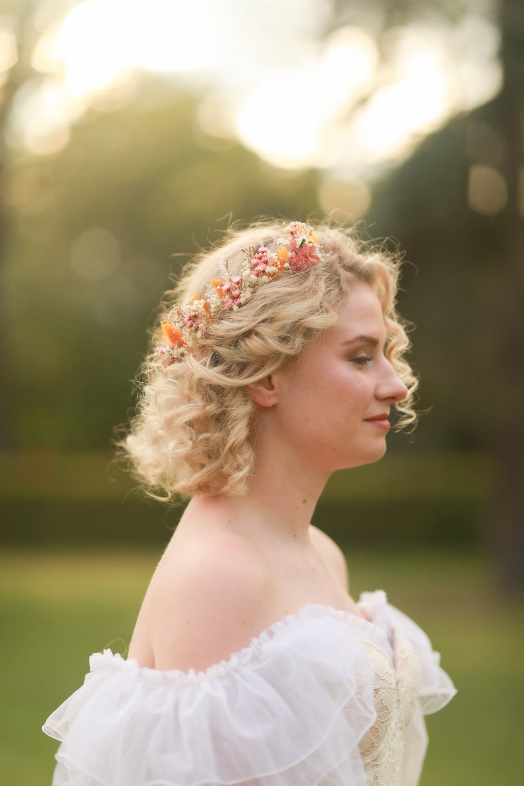 Woman with floral natural rustic hairpins in a natural setting