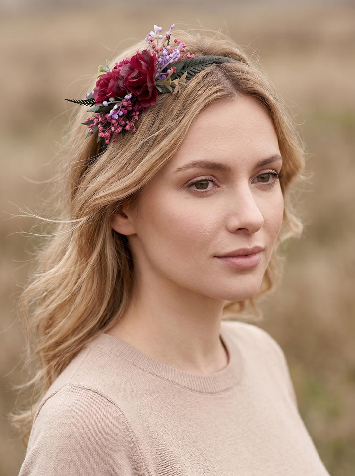 Woman wearing a floral headband in a natural setting