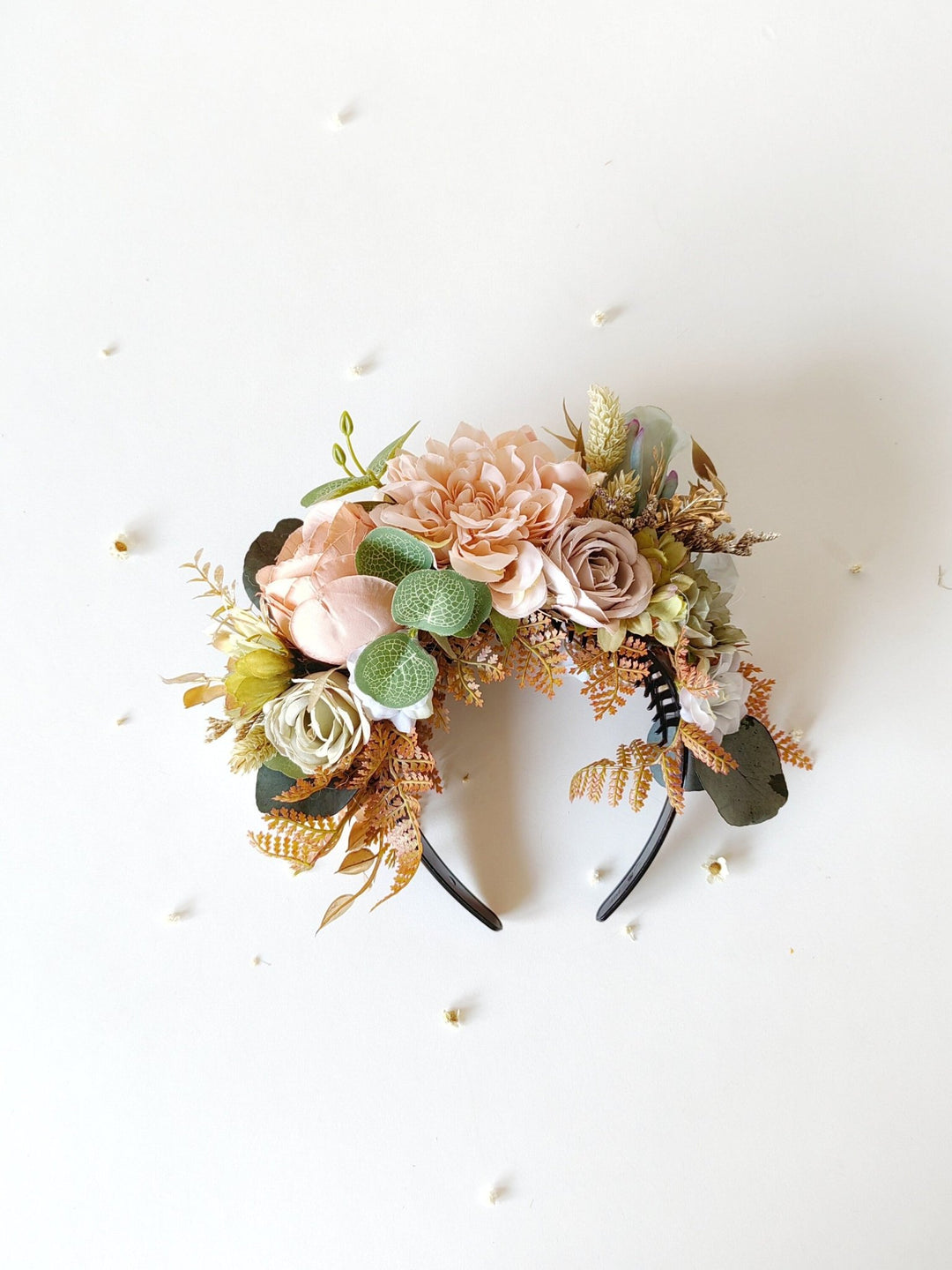 Floral headband with pink and green flowers on a white background