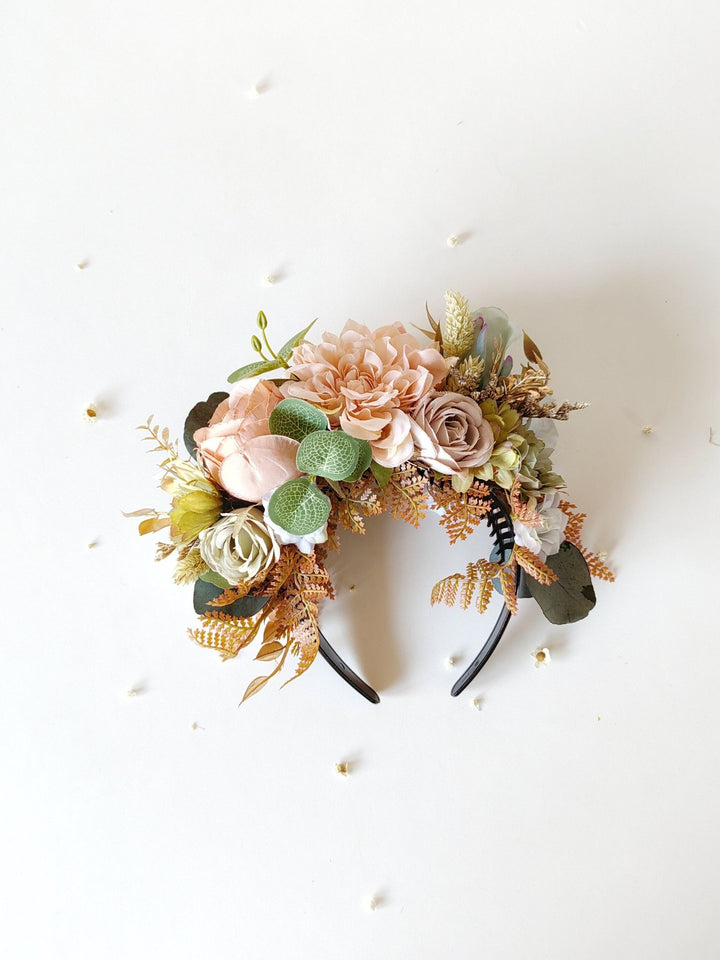 Floral headband with pink and green flowers on a white background