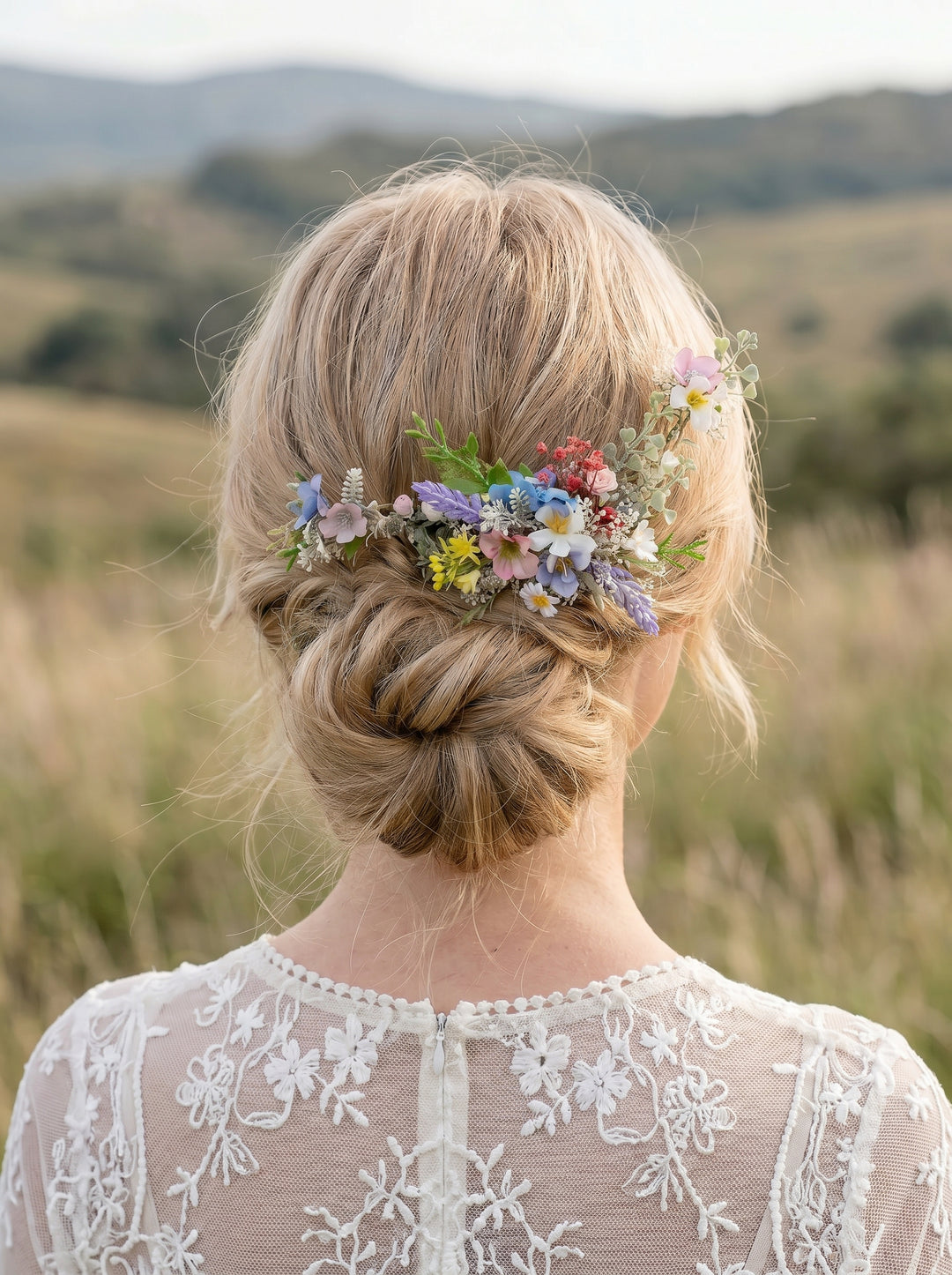 Woman with flora wildflowers pastel l hairpiece in a field