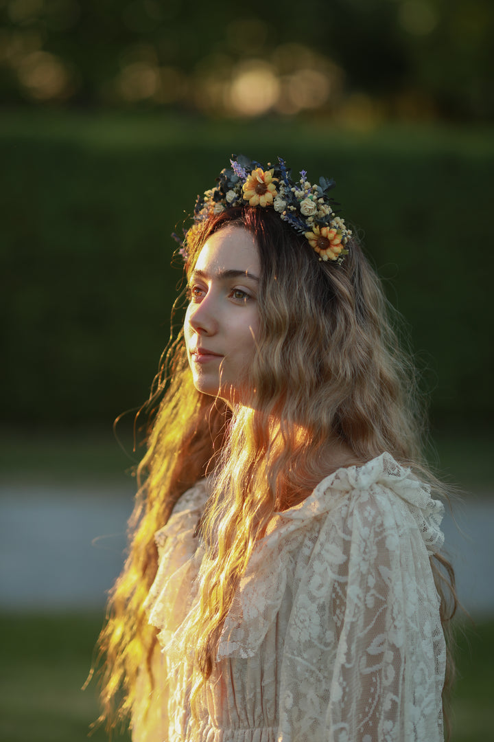 Woman with a floral headpiece in a natural setting