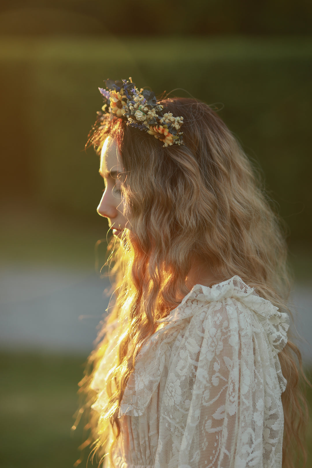 Woman with a floral headpiece in a natural setting