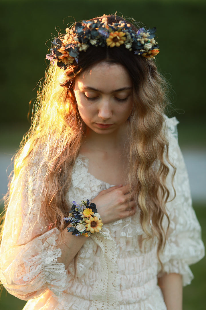 Woman wearing a floral crown andbracelet of flowers in a natural setting